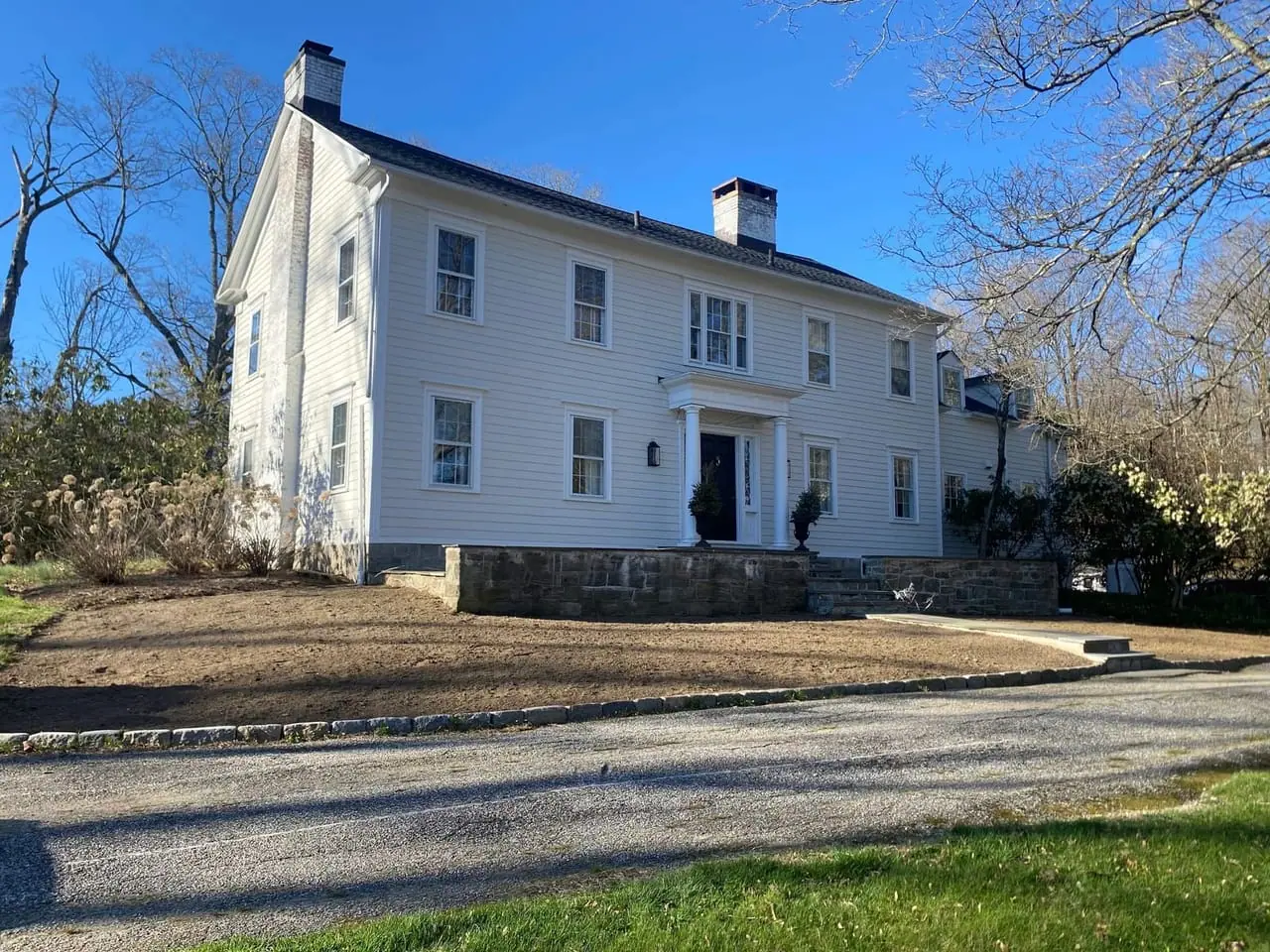 Before photo of the front lawn area prepared for new sod installation at a home in Wilton, CT