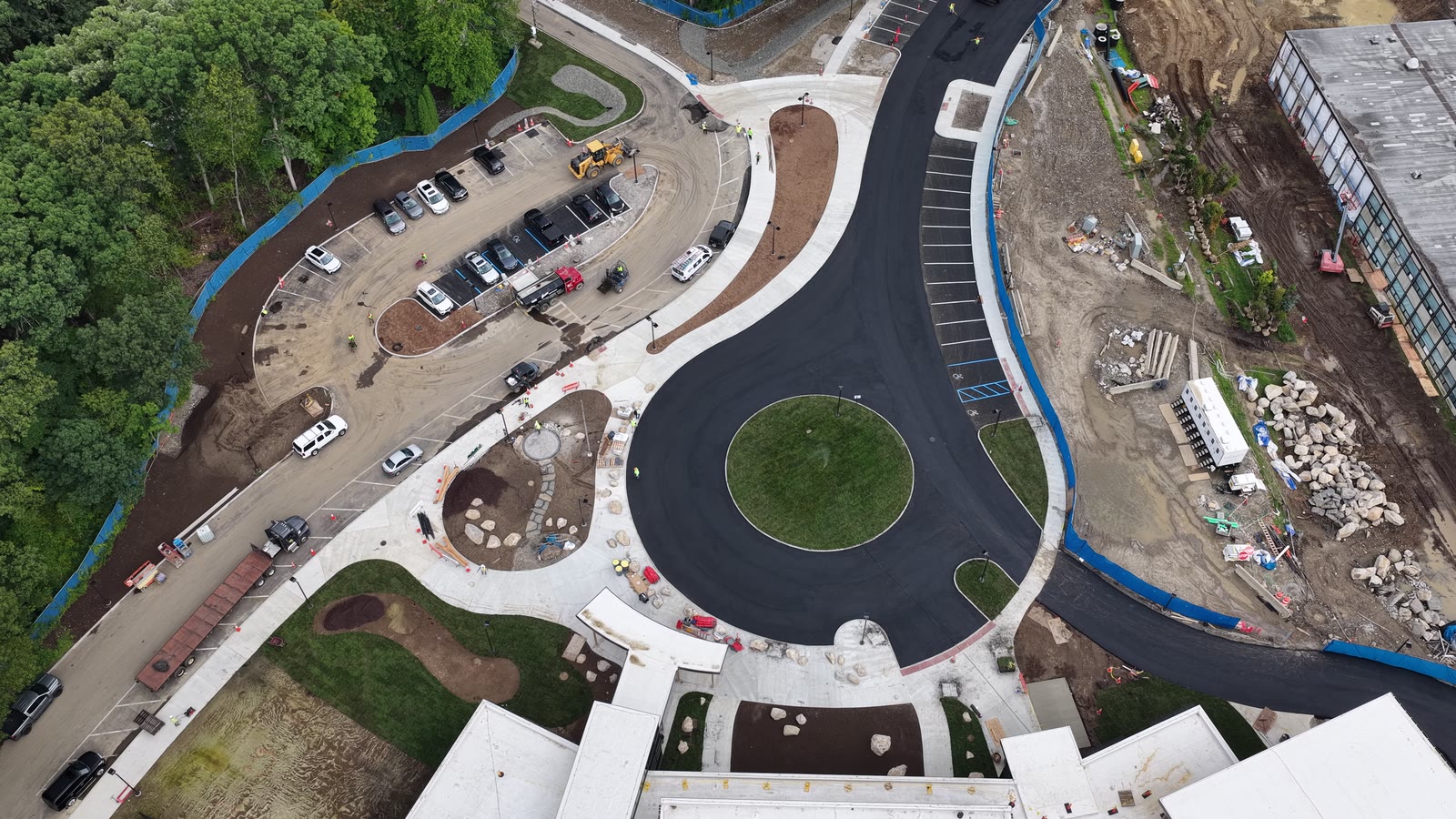 Friday afternoon progress aerial over the main entrance circle, where installed sod was already changing the center of the active school construction site