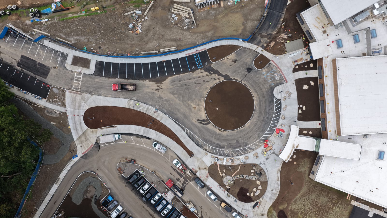 Friday morning overview of the Greenwich school entrance, walks, and open lawn zones before sod installation