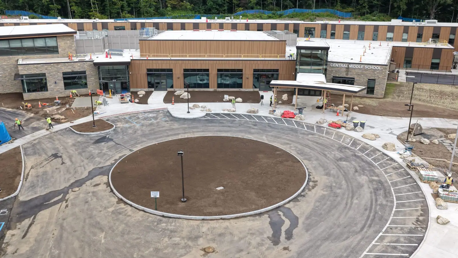Low Friday-morning drone view toward Central Middle School before the sod transformation