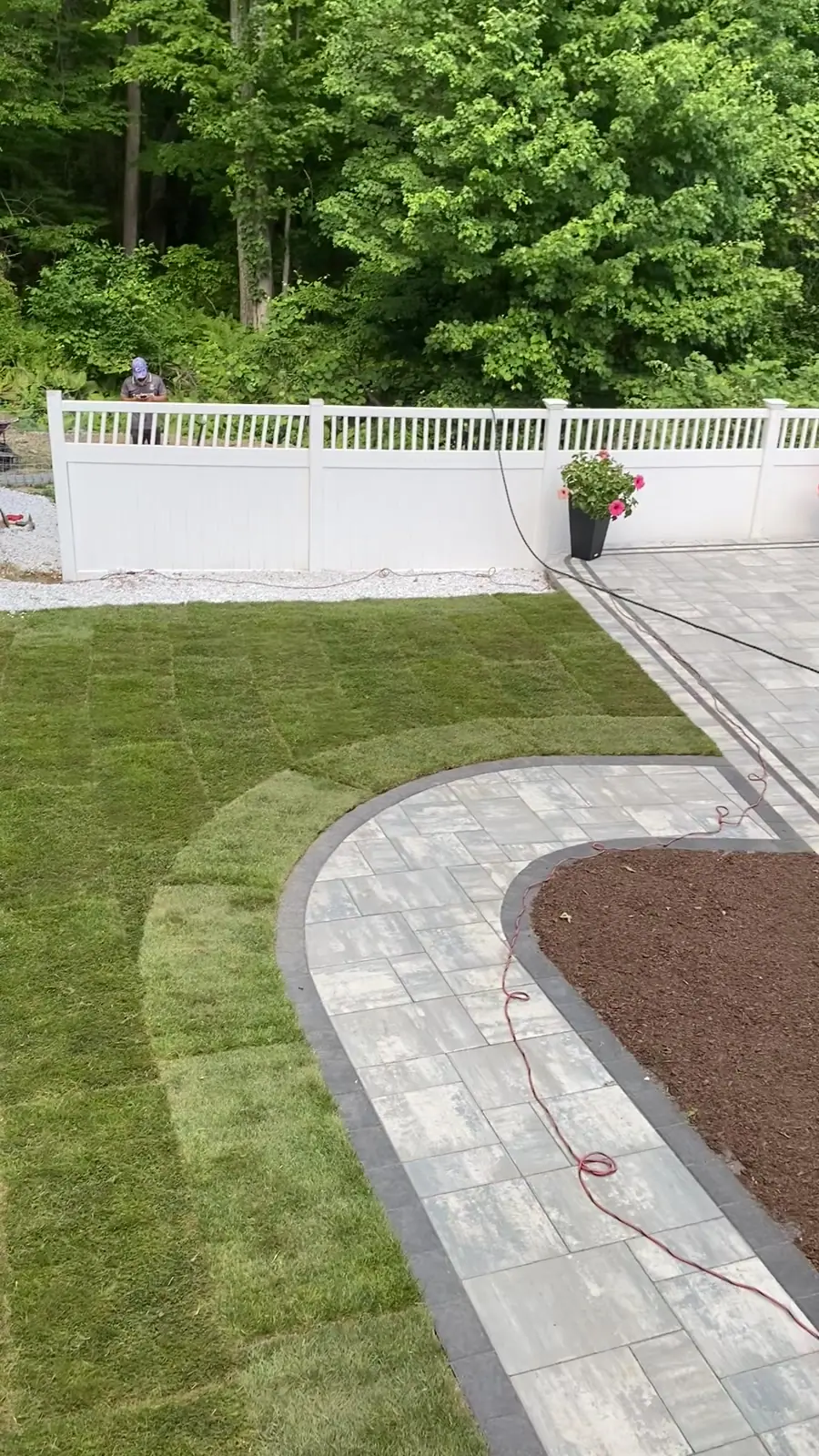Finished turf installation around a pool patio in Milford, CT