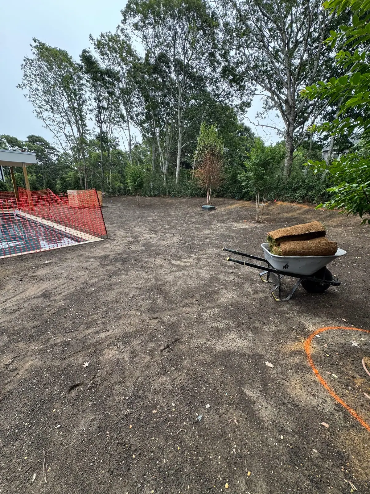 Fresh sod rolls arriving by the wheelbarrow-load on install day in Montauk, NY