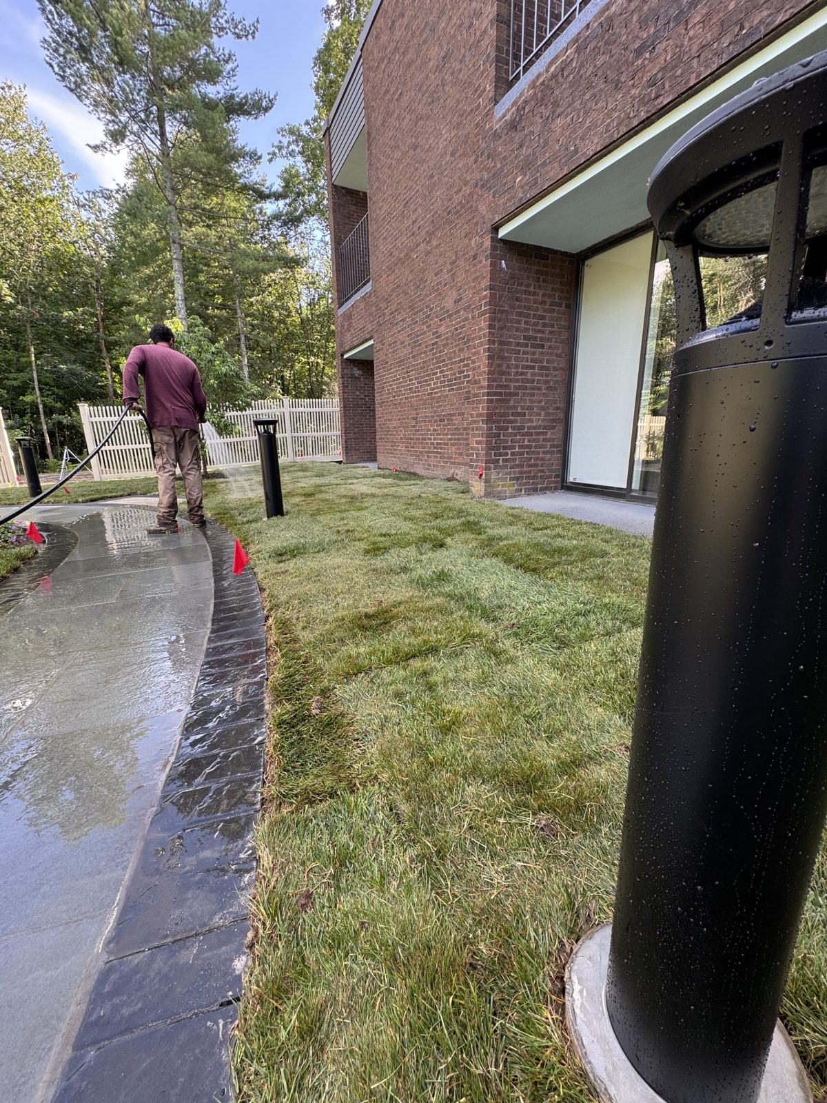 Wide view of fresh sod, walkway, and watering at the New Canaan, CT commercial property