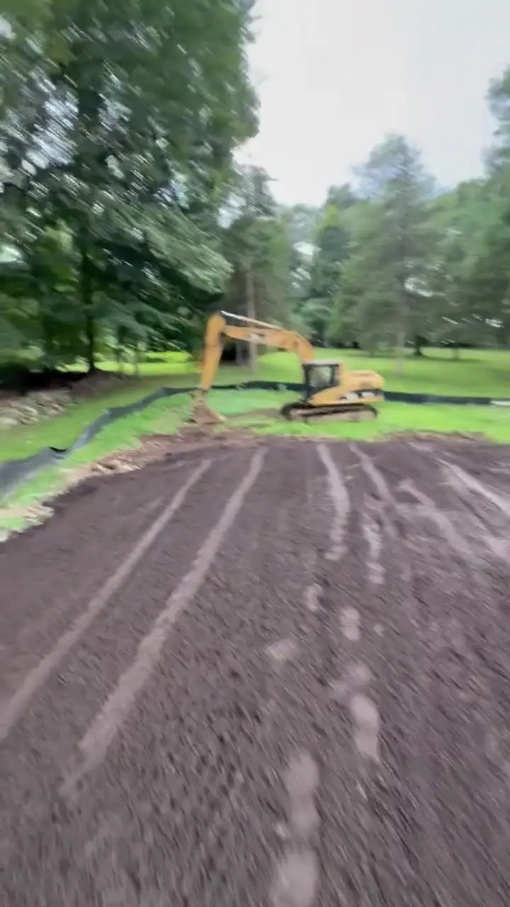 By 5 p.m. Saturday, six loads of soil had been spread across the New Canaan, CT lawn areas; CT Sod returns Monday for finish prep before sod installation