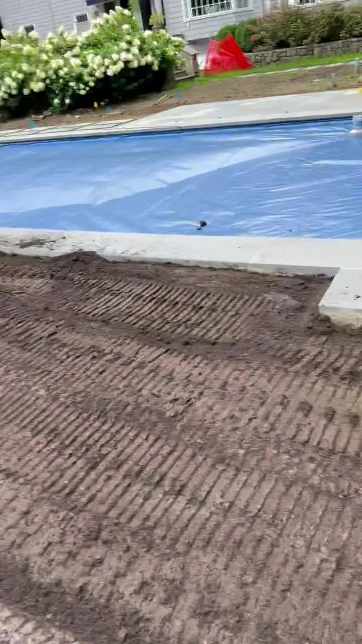 A 2:30 p.m. walkthrough of screened topsoil spread and being prepared beside the pool at the New Canaan, CT project before the 7,000-square-foot sod installation