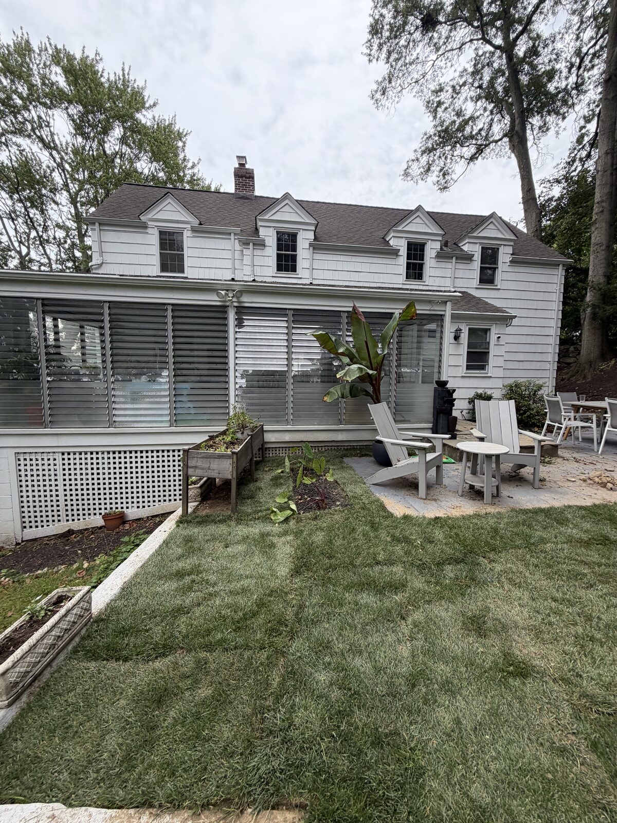 Newly laid sod beside the house and patio at the Norwalk, CT installation
