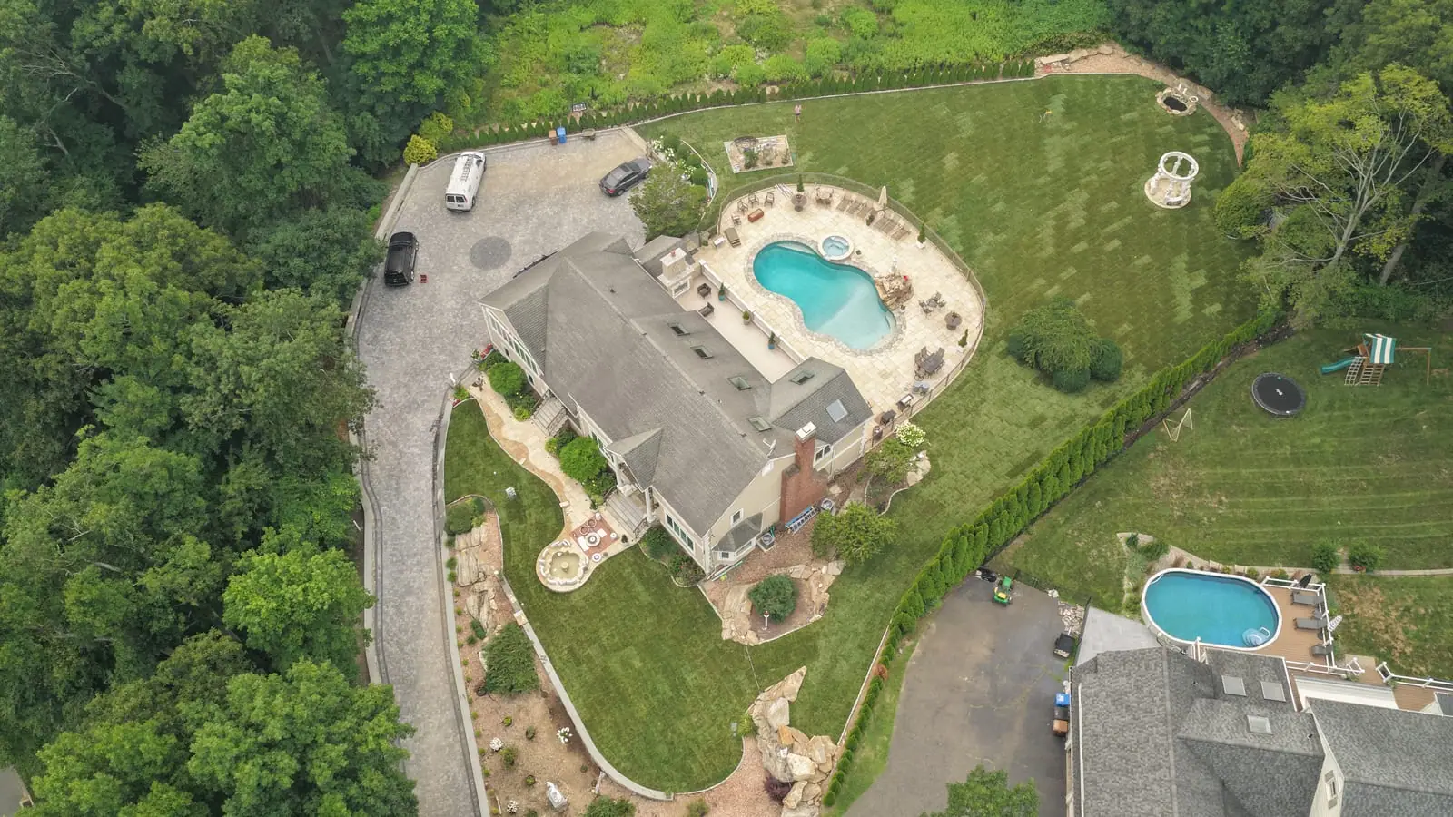 Aerial view of a finished 17,000 square foot new sod lawn wrapping around a new pool and patio at a Shelton, CT home