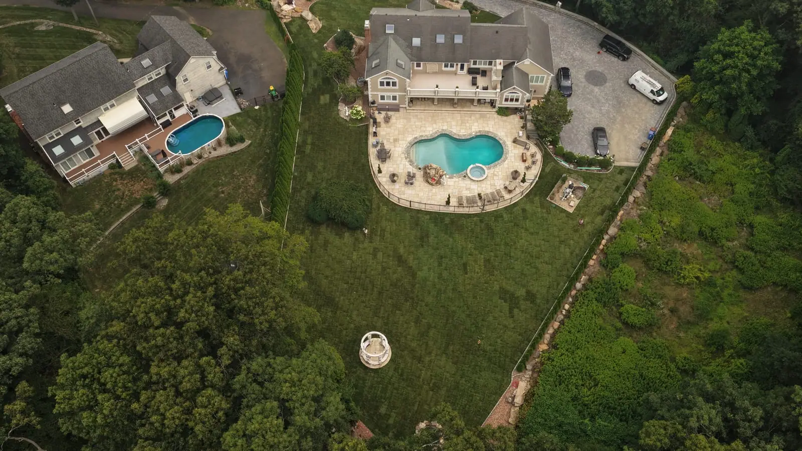 Aerial view of the finished Shelton, CT lawn — fresh sod covering the entire 17,000 square foot yard around the new pool, spa patio, and gazebo