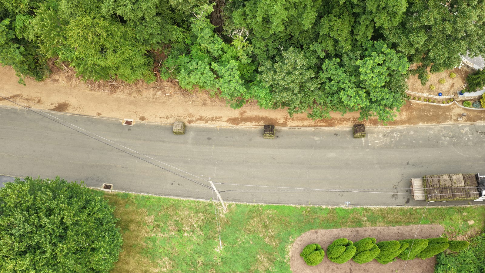 Pallets of fresh-cut sod staged along the street on install day at a Shelton, CT delivery
