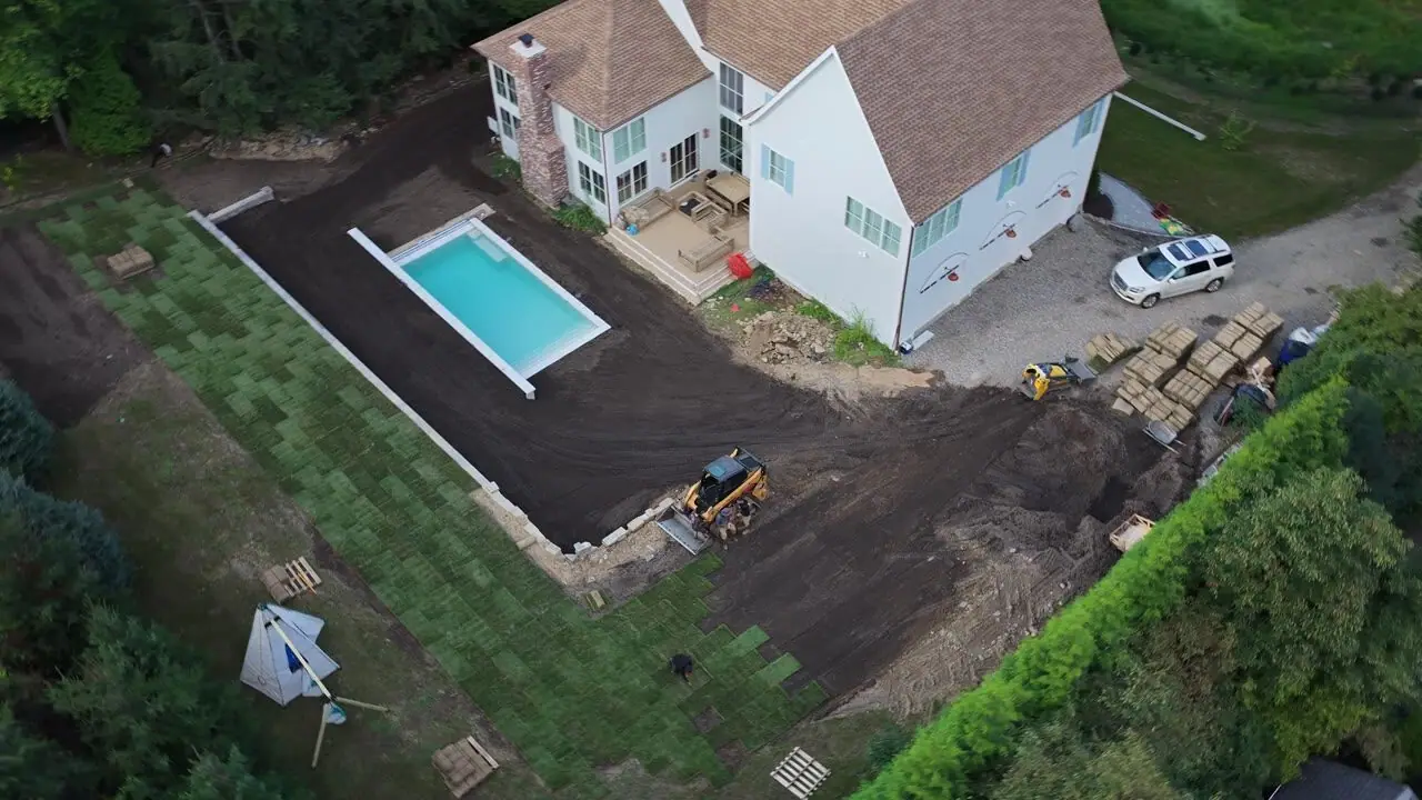 The day's last pass — up and away over the property with most of the yard already green
