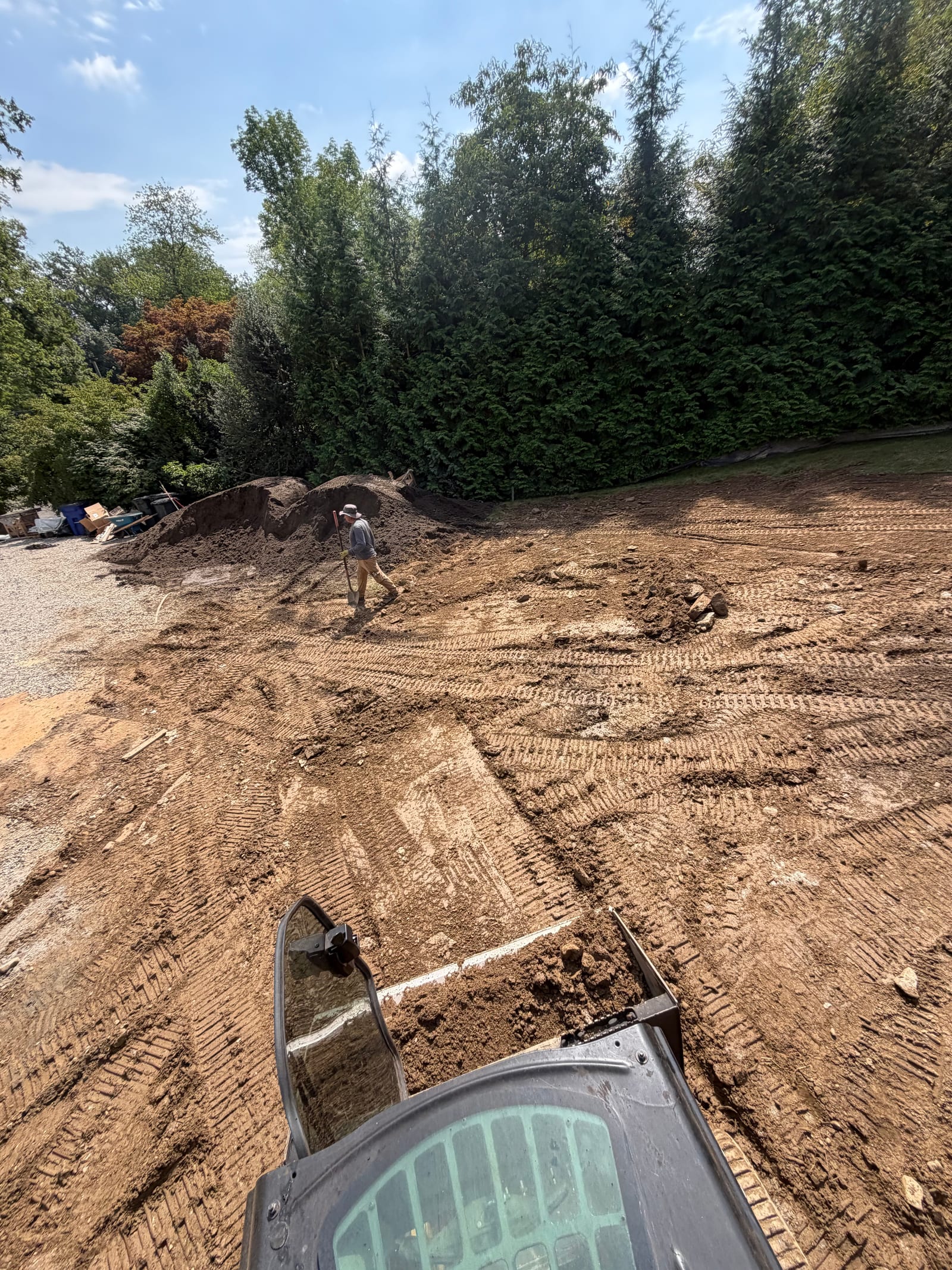 Machine-level view of the rocky lower yard while ground preparation continues around the Westport pool project