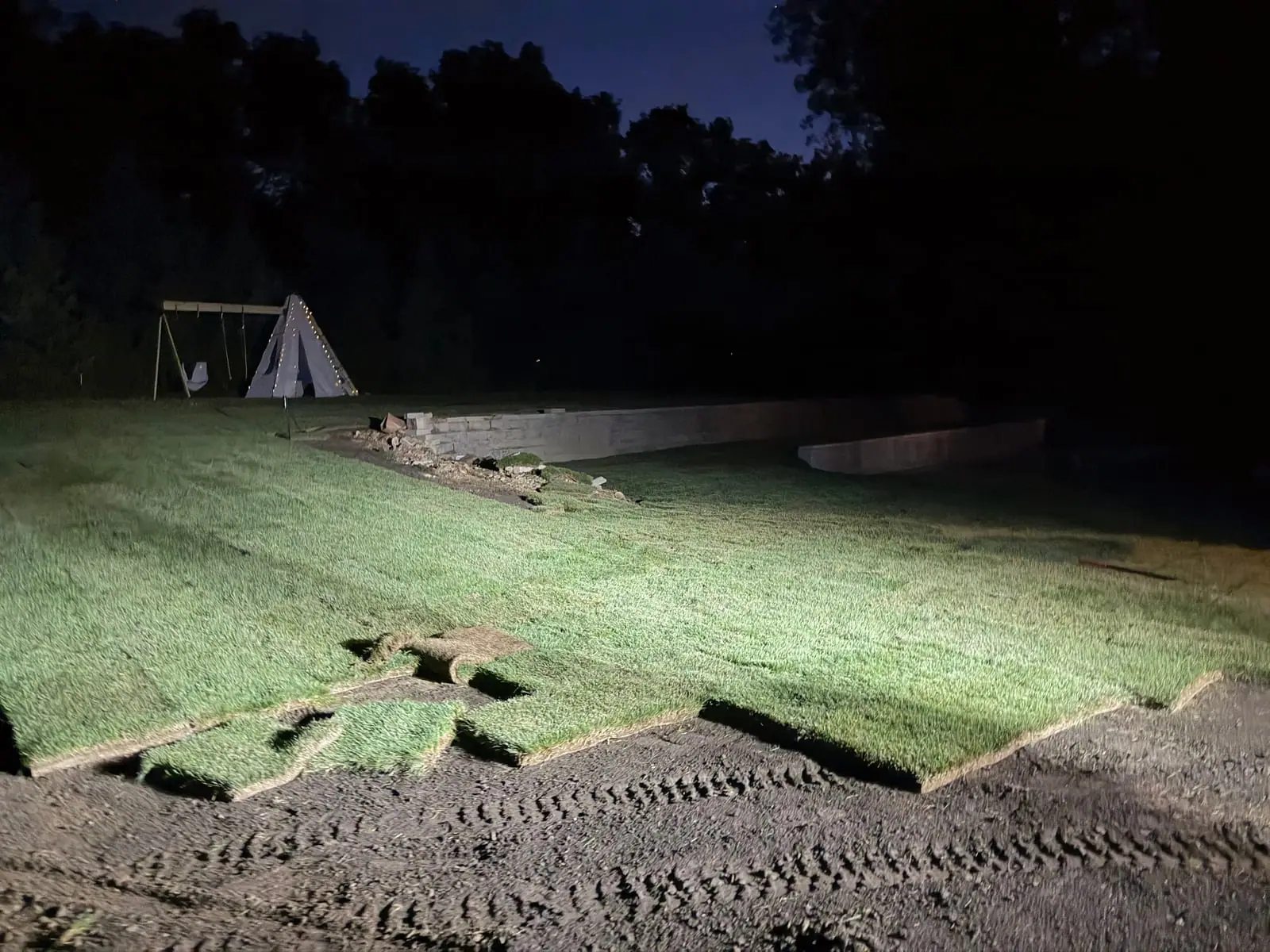 Fresh sod down at dark after a one-day installation in Westport, Connecticut