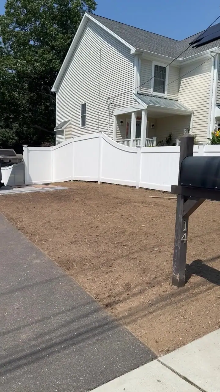 Pan across the stripped and graded front yard in Milford, CT, prepped and ready for fresh-cut Kentucky bluegrass sod