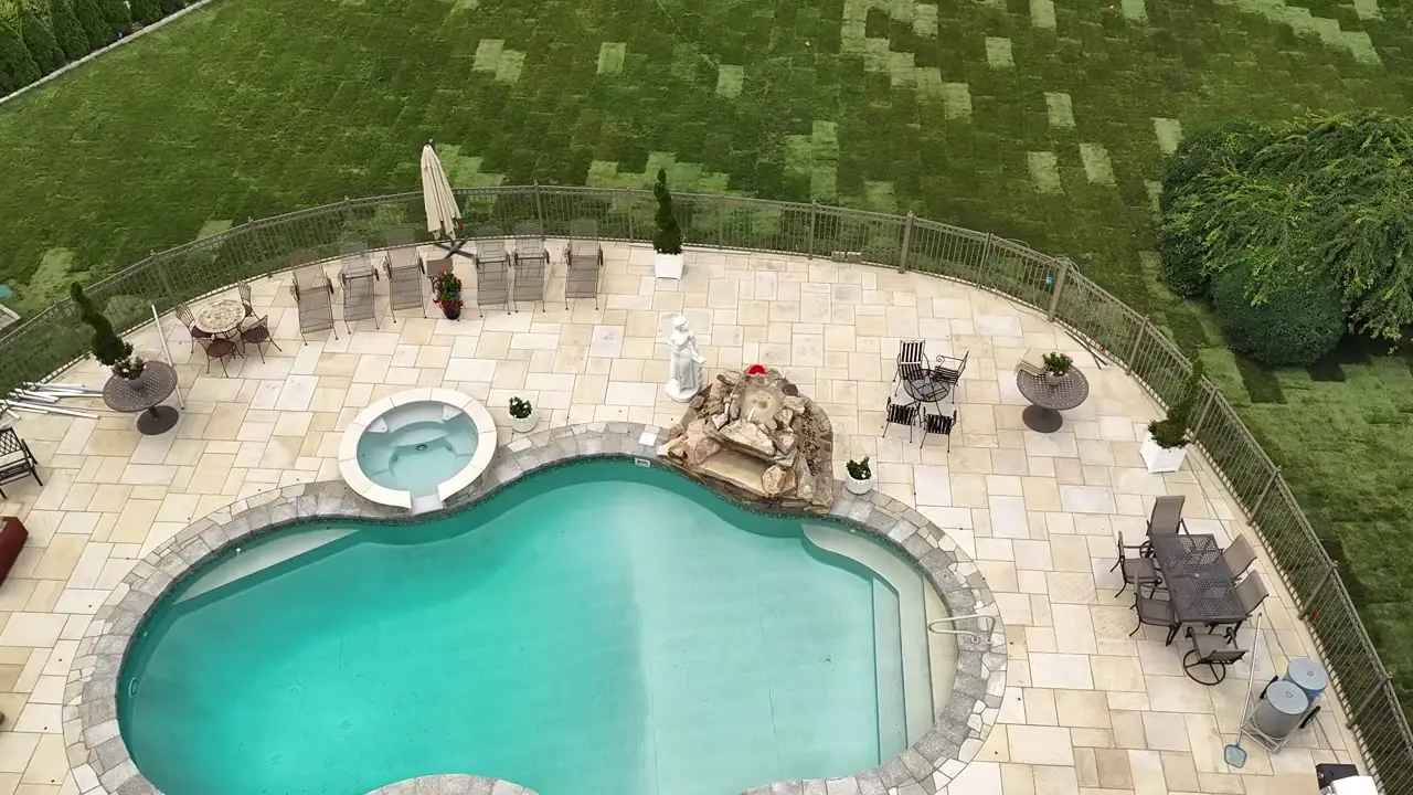 Drone shot rising from the Shelton, CT pool deck to a wide view of the whole property covered in fresh sod