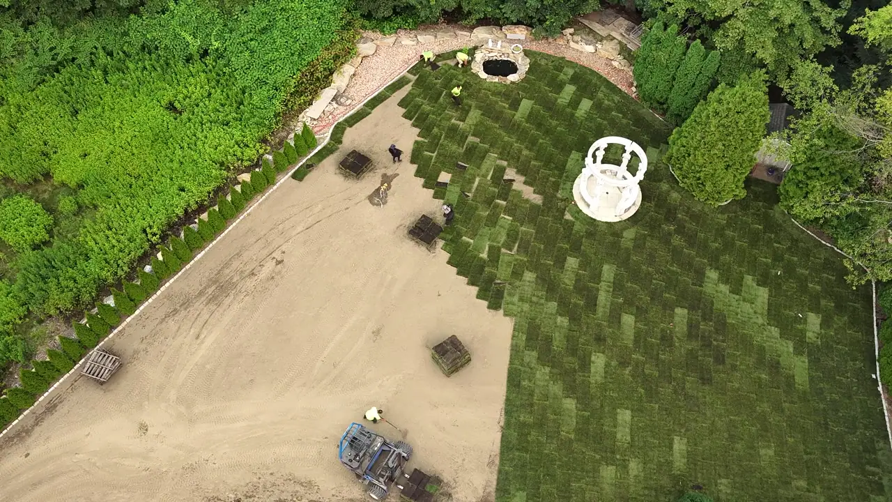 Drone flyover of the Shelton, CT yard at the halfway mark, fresh sod wrapping the gazebo and water feature