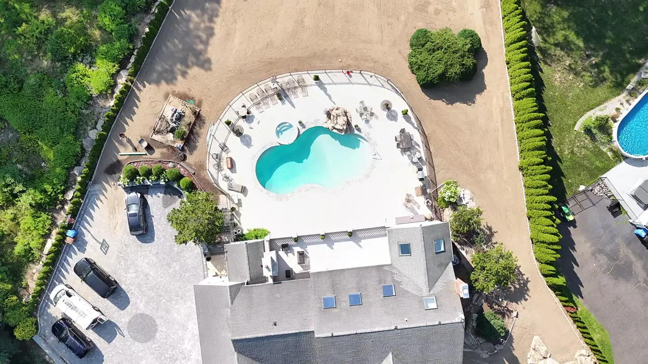 Final prep flyover — from the street, up the driveway, and across all 17,000 square feet of finished grade around the new pool and gazebo in Shelton, CT