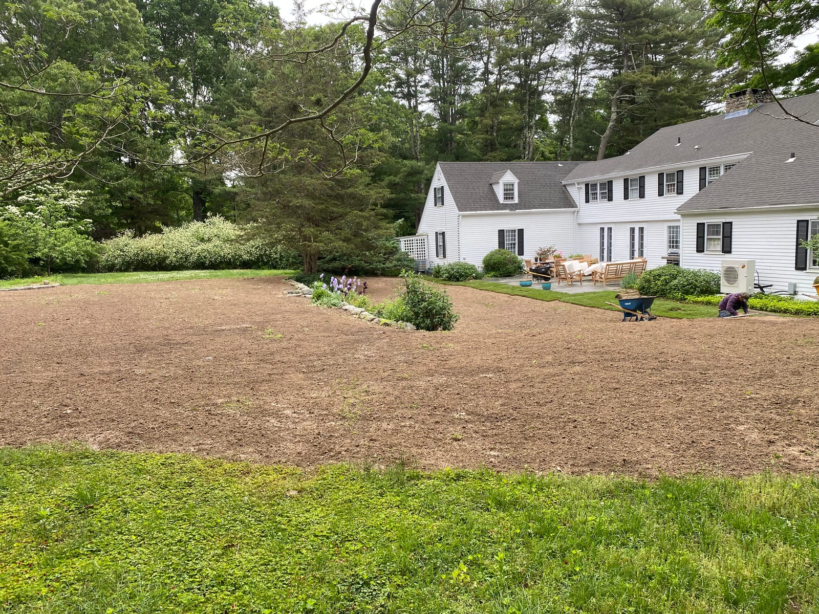 Westbrook CT backyard prepped and graded to bare soil, ready for fresh sod installation