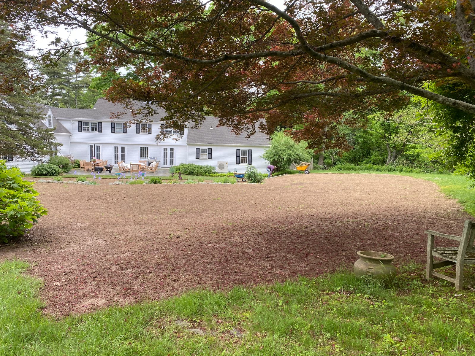 Bare graded soil across a 6,000 sq ft Westbrook backyard the day before sod installation